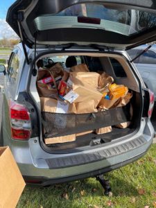 thanksgiving food drive bags packed into the back of an suv