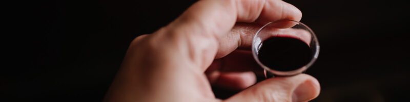 holding a communion cup